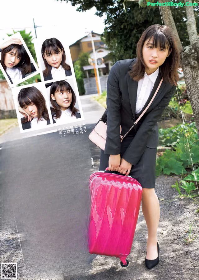 A woman in a business suit holding a pink suitcase.